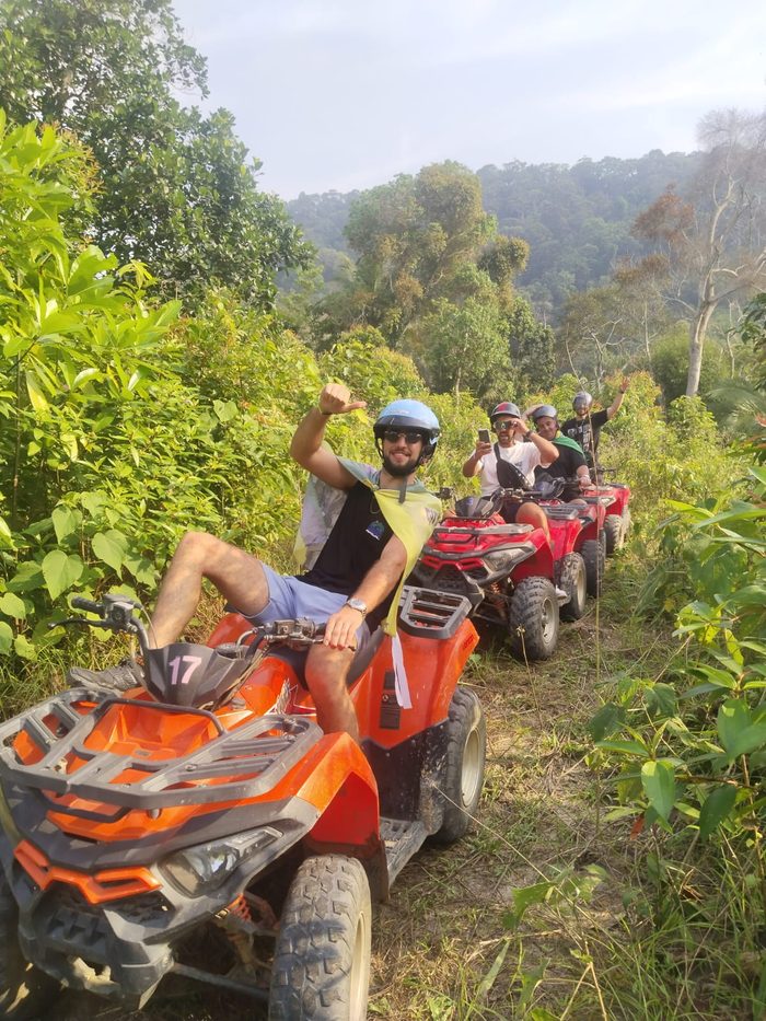 ATV rider giving a thumbs up on a jungle trail, Koh Phangan